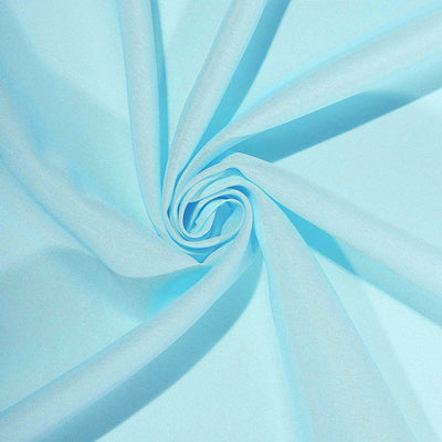 Light blue fabric swirl showcasing texture and drape.
