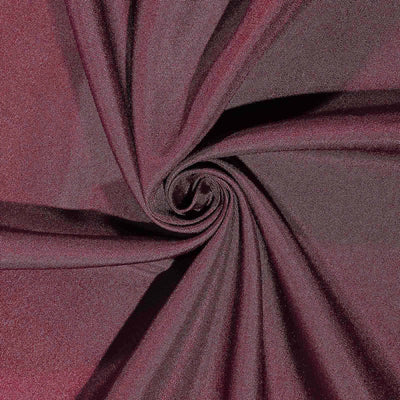 Burgundy fabric swirl texture showing soft, smooth material details.