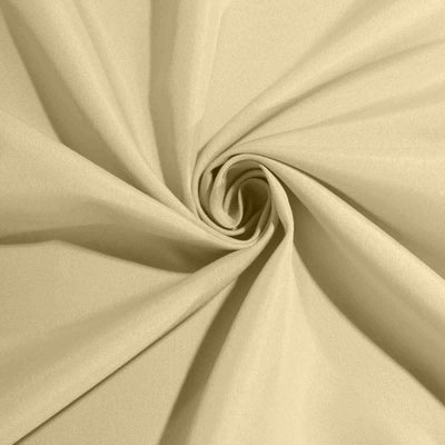 Beige fabric texture in a swirling pattern.
