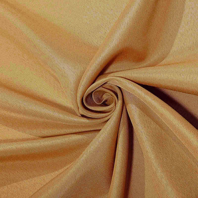 Textured golden fabric swirled elegantly in a close-up shot.