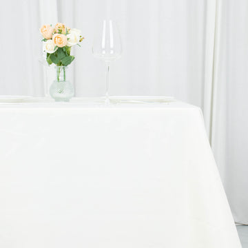 Elevate Your Event with the Ivory Premium Seamless Polyester Square Table Overlay