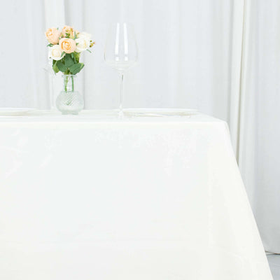 Elegant table setting with flowers and glassware.
