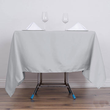 Create a Stunning Tablescape with the Silver Square Seamless Polyester Table Overlay