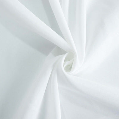 White fabric texture showcasing soft folds and smooth surface.