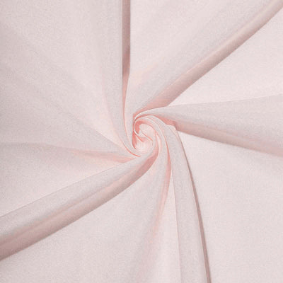 Light pink fabric swirl texture close-up, showcasing softness and drape.