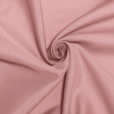 Soft pink fabric texture in a swirling pattern.