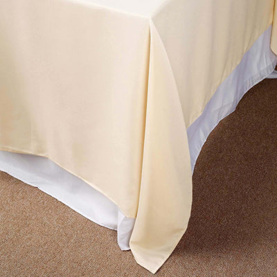 Beige tablecloth draped elegantly over a table edge.