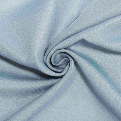 Light blue textured fabric in a spiral pattern.
