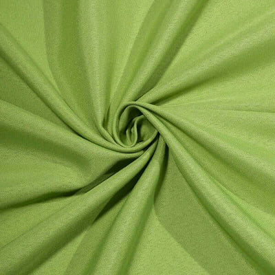 Green fabric texture in a swirling pattern.