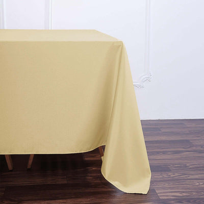 Beige tablecloth draped elegantly over a wooden table.