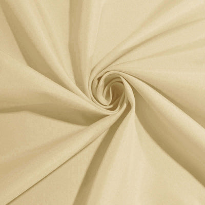 Beige fabric swatch with a smooth texture, folded in a spiral pattern.