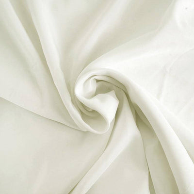 Soft, flowing white fabric draped elegantly.