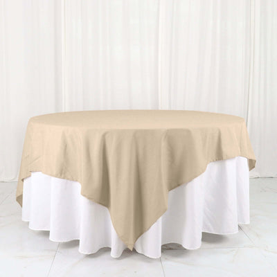 Beige round tablecloth draped elegantly over a white table.