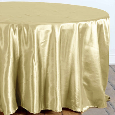 Gold satin tablecloth draping elegantly over a round table.