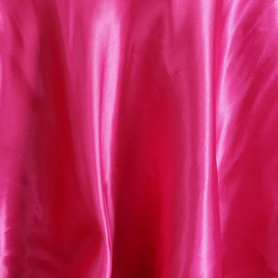 Shiny pink satin fabric draped elegantly.