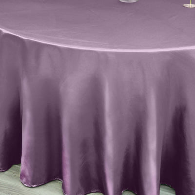 Purple satin tablecloth elegantly draping over a round table.