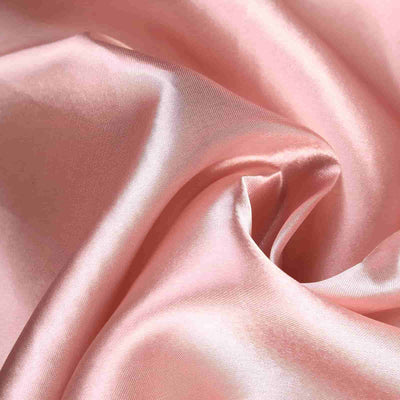 Soft pink satin fabric with a smooth, luxurious texture.