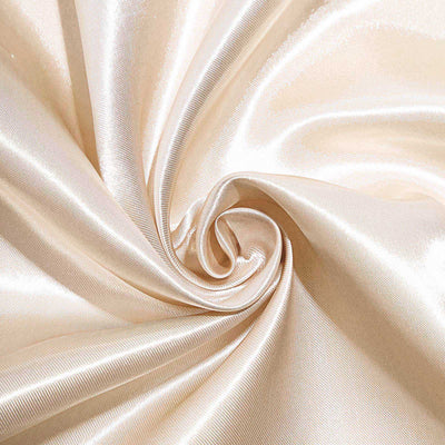Cream satin fabric close-up showing smooth texture and sheen.