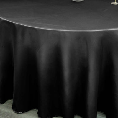 Black round tablecloth elegantly draping over a circular table.