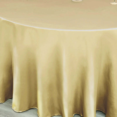 Gold satin tablecloth draping elegantly on a round table.