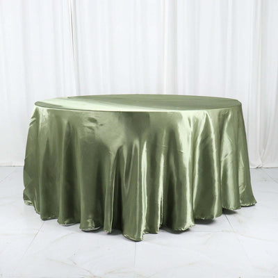 Green satin round tablecloth draped elegantly on a table.