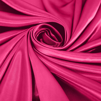 Vibrant fuchsia satin fabric swirl texture close-up.