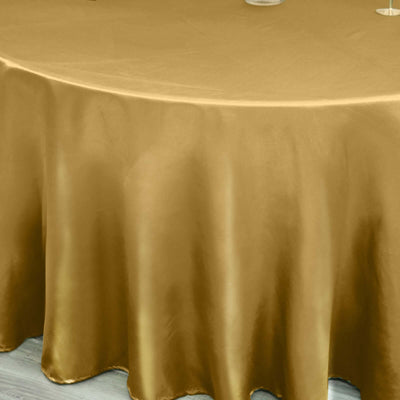 Gold satin tablecloth on a round table.
