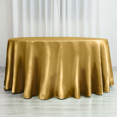Gold satin tablecloth draped elegantly on a round table.