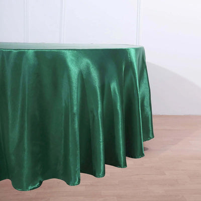 Green satin tablecloth draped elegantly over a table.