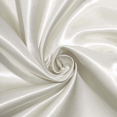 Silky white fabric in a swirling pattern showcasing its smooth texture.