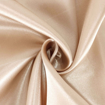 Satin fabric in soft beige color with a smooth texture.