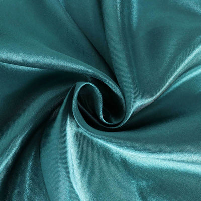 Teal satin fabric with a smooth, glossy finish in a spiral pattern.