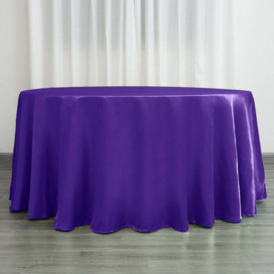 Purple satin tablecloth draped over an oval table.