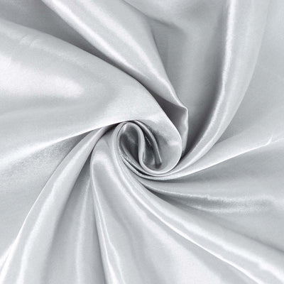 Silky silver fabric with a smooth texture and elegant sheen.