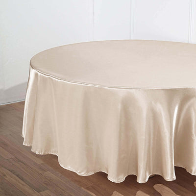Beige round tablecloth on a wooden surface.