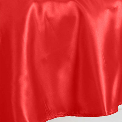 Red satin fabric texture with a smooth, glossy finish.