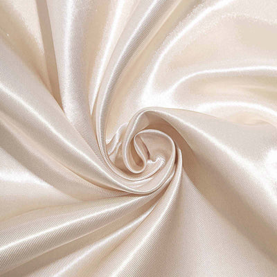 Shiny ivory satin fabric in a swirling pattern.