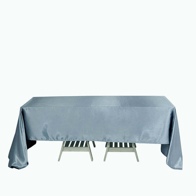 Silver tablecloth on a table with wooden slats