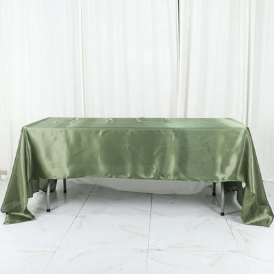 Green satin tablecloth draped elegantly over a table.