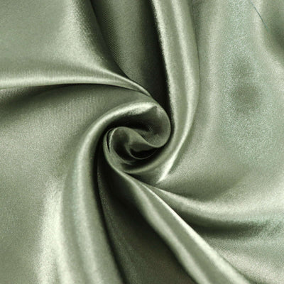 Smooth olive green satin fabric swirl close-up texture.