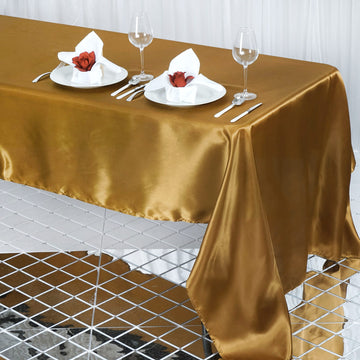 Add Elegance to Your Event with the Gold Seamless Satin Rectangular Tablecloth 60"x126"