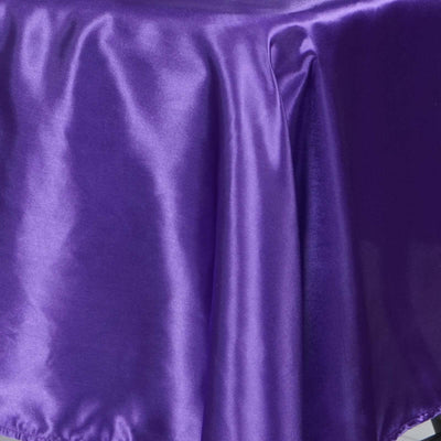 Purple satin fabric draped elegantly on a surface.
