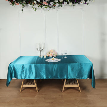 Enhance Your Event Decor with a Teal Satin Tablecloth