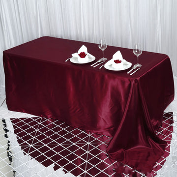 Experience Luxury with the Burgundy Satin Seamless Rectangular Tablecloth