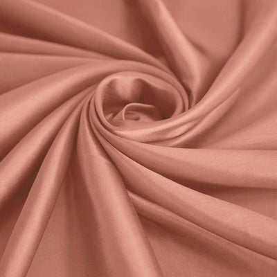 Peach satin fabric with a smooth, elegant drape.