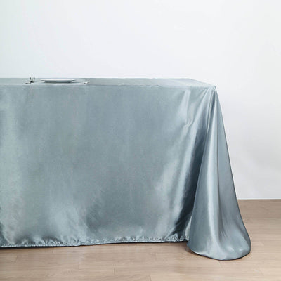 Silver satin tablecloth draped elegantly over a table