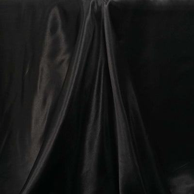 Black satin fabric with elegant drapery and soft sheen.