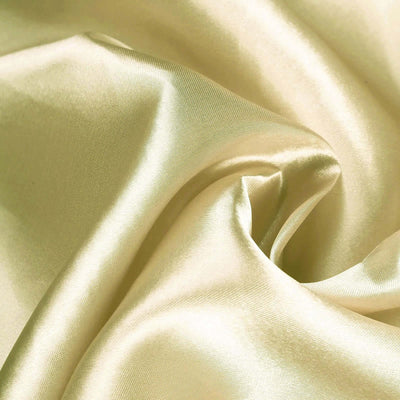 Soft, luxurious cream satin fabric with gentle folds and sheen.