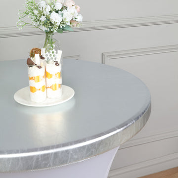 Add Elegance to Your Event with the Metallic Silver Spandex Stretch Fitted Cocktail Table Top Cover