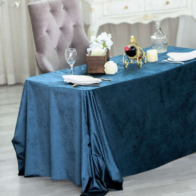 Elegant navy blue tablecloth draping over a table, perfect for formal dining settings.